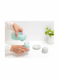 Saippuaa annosteleva tiskiharja